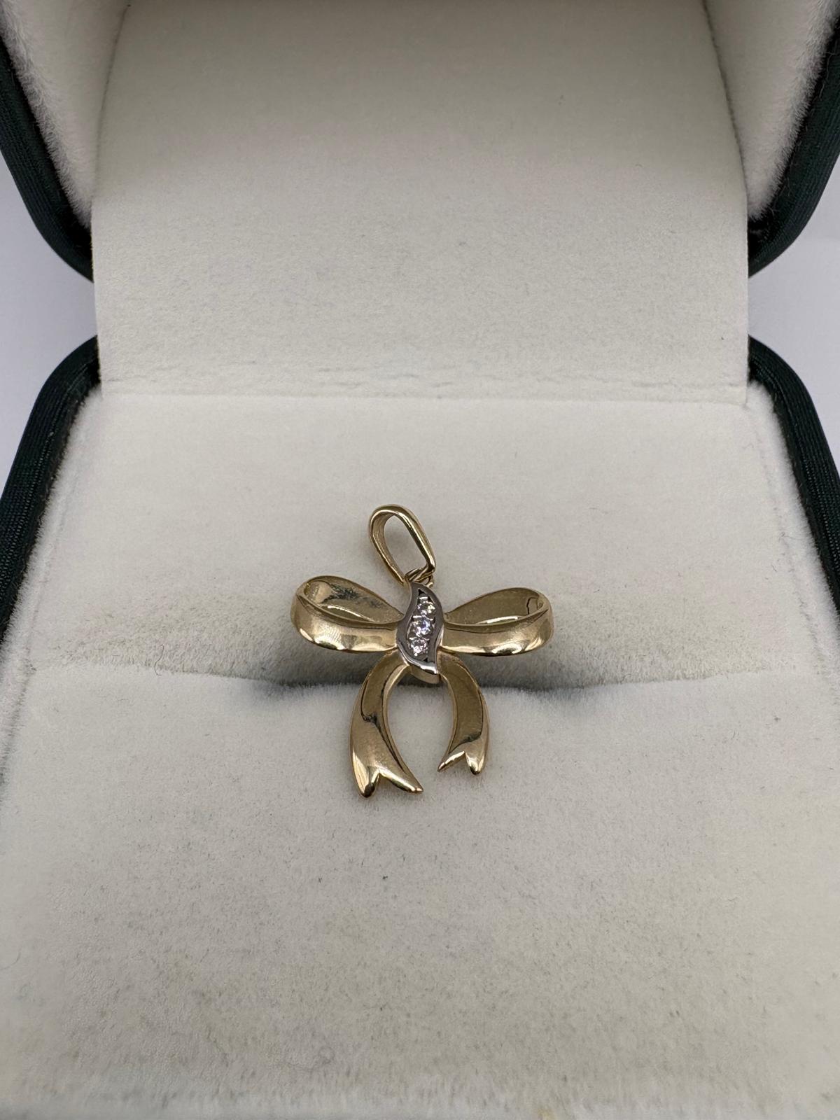 9ct gold diamond bow pendant