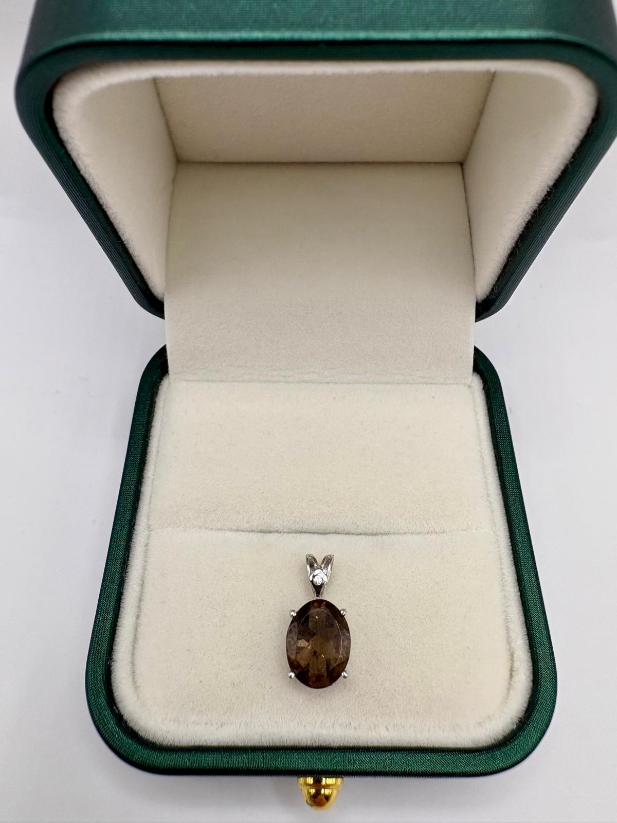 9ct white gold diamond and smokey quartz pendant