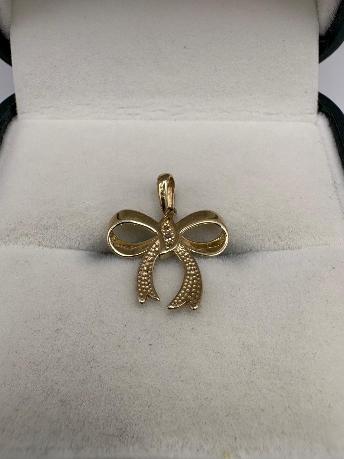9ct gold diamond bow pendant