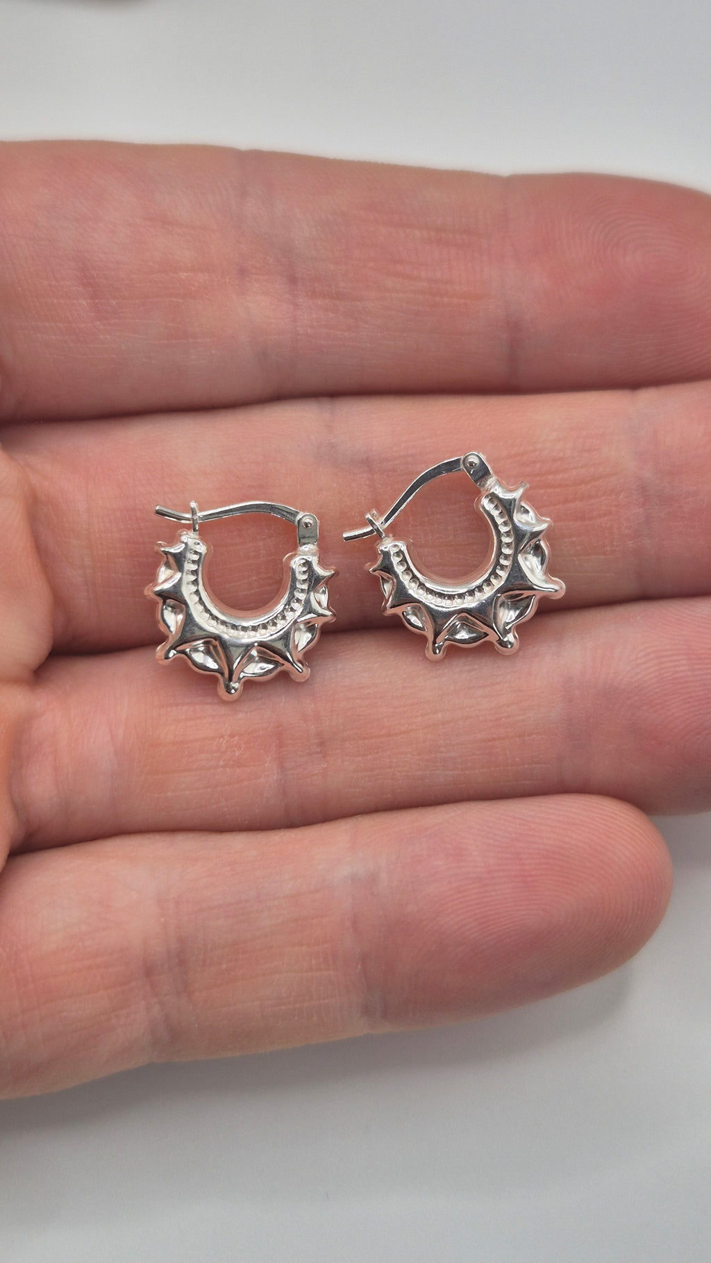 Silver spike creole earrings