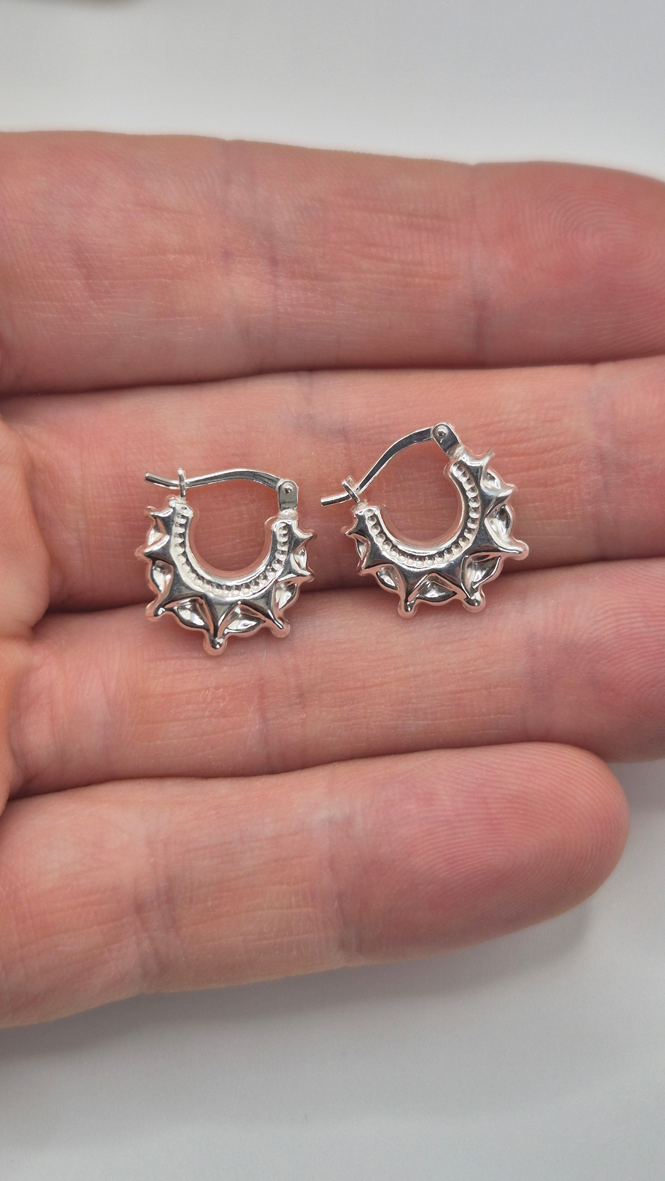 Silver spike creole earrings