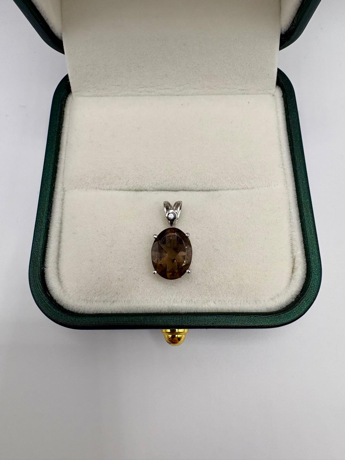 9ct white gold diamond and smokey quartz pendant