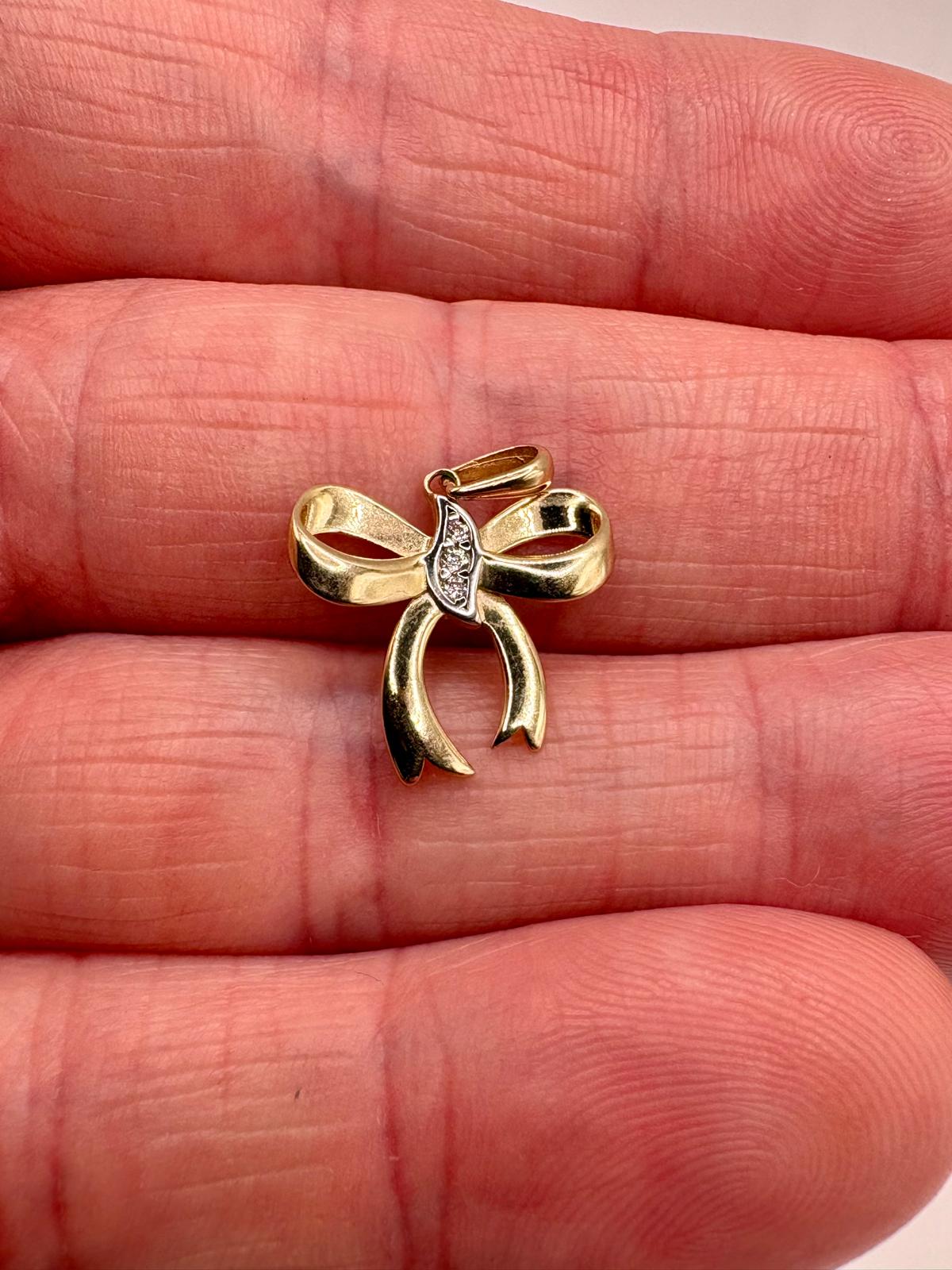 9ct gold diamond bow pendant