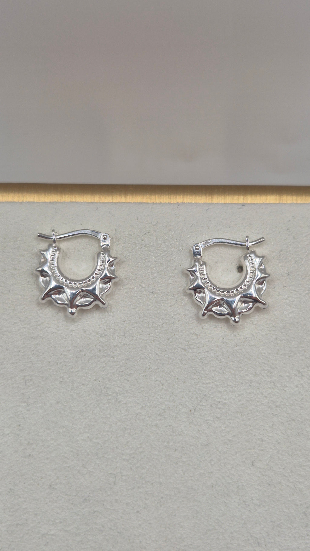 Silver spike creole earrings